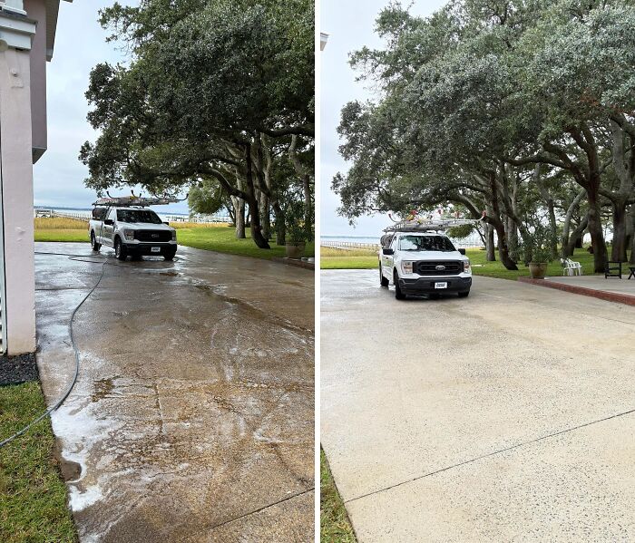 Satisfying power washing of a long, grimy driveway, showcasing a clean, bright transformation.