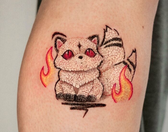 A charming tattoo with a crayon drawing aesthetic, depicting a furry fox-like creature with red eyes surrounded by flames, reflecting childhood creativity.