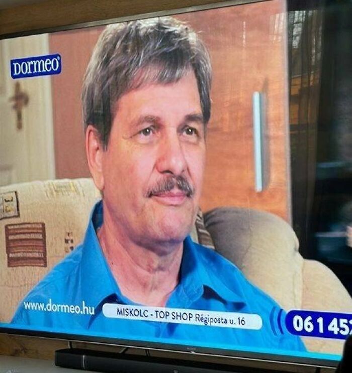 A man with a mustache on a TV screen for Dormeo, depicting how people from Eastern Europe are built different.