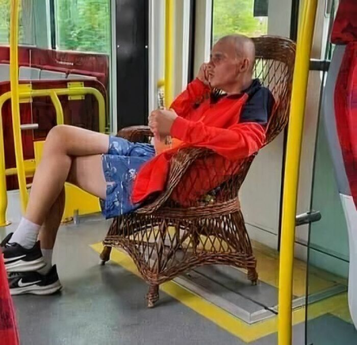 Man from Eastern Europe relaxing in a wicker chair on a public bus, illustrating how people are built different.