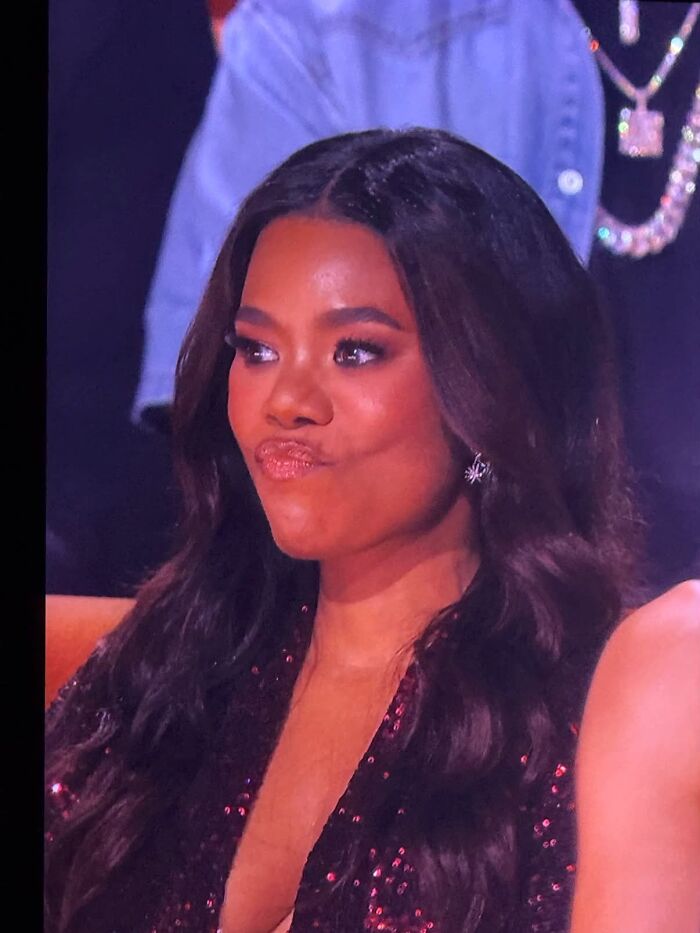 A woman making a pouting face, perhaps reacting to news about her soulmate cheating.
