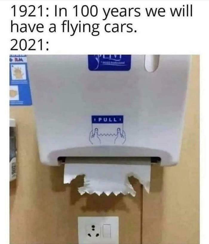 A meme contrasting 1921 predictions of flying cars with 2021 reality of a broken paper towel dispenser, funny random jokes.
