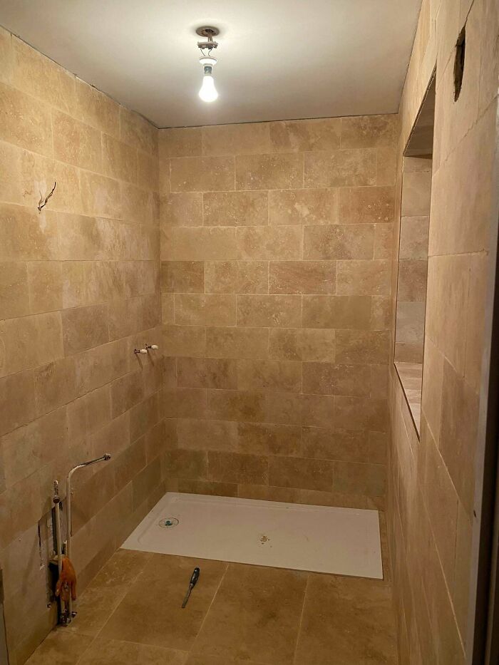 Before and after of a home renovation featuring a tiled shower stall under construction, showcasing amazing things.