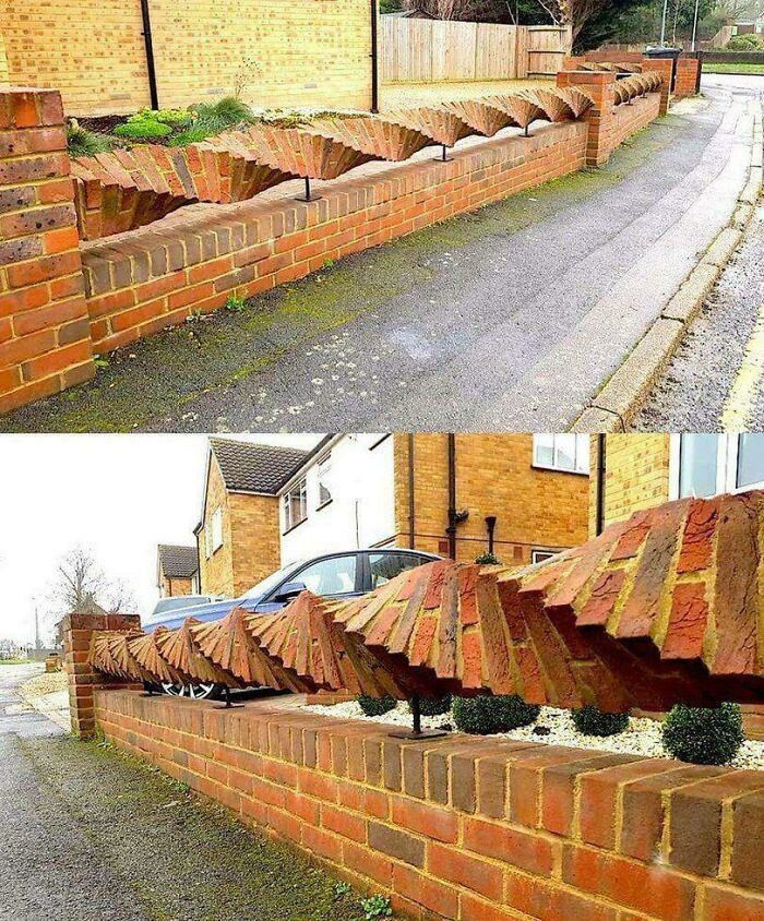 Unique brick fence with a wavy, decorative top design, a creative home renovation concept.