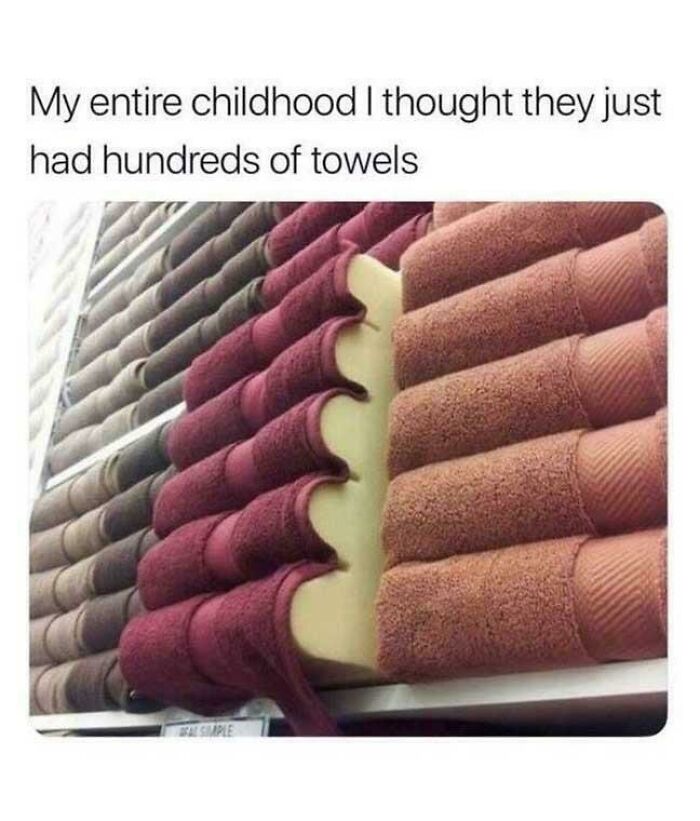 A retail display of stacked towels revealing a foam insert for volume, a fascinating find showing merchandising tricks.