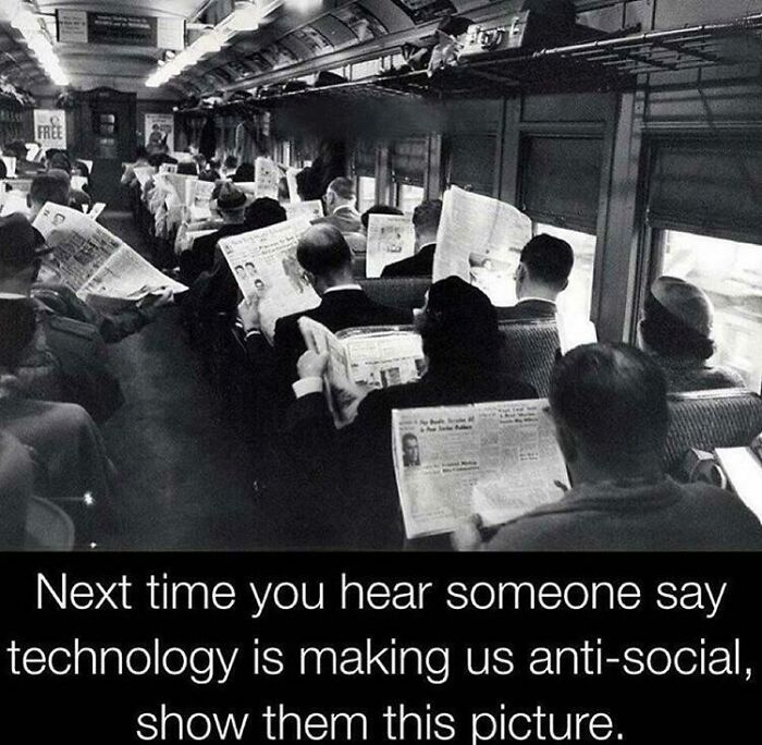 A black and white image of commuters on a train reading newspapers, a fascinating find about social interaction.