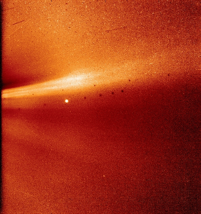 A bright, blurry, fascinating find from space, showing a celestial body against a gradient of orange and red.