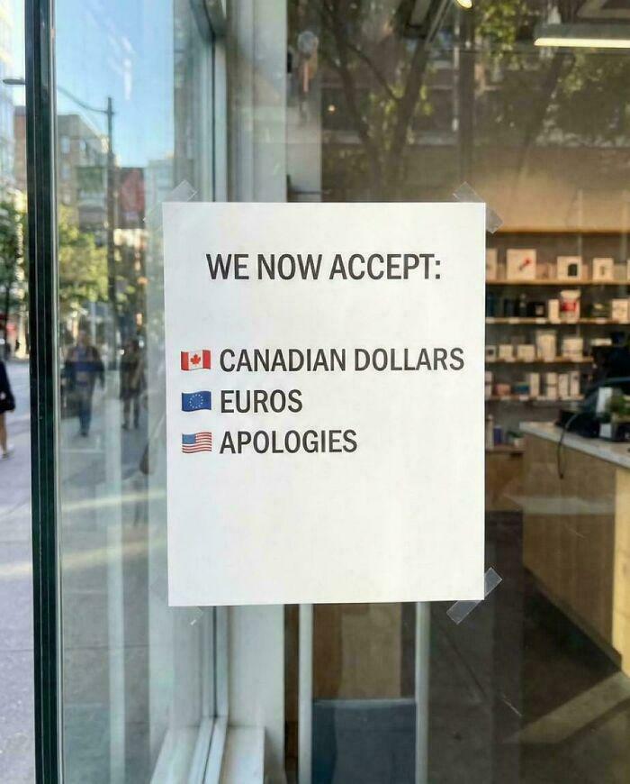 A sign on a glass door listing acceptable payments: Canadian Dollars, Euros, and Apologies, a random joke.