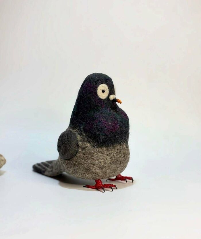 A charming, felted pigeon figure, one of many unique handmade projects.
