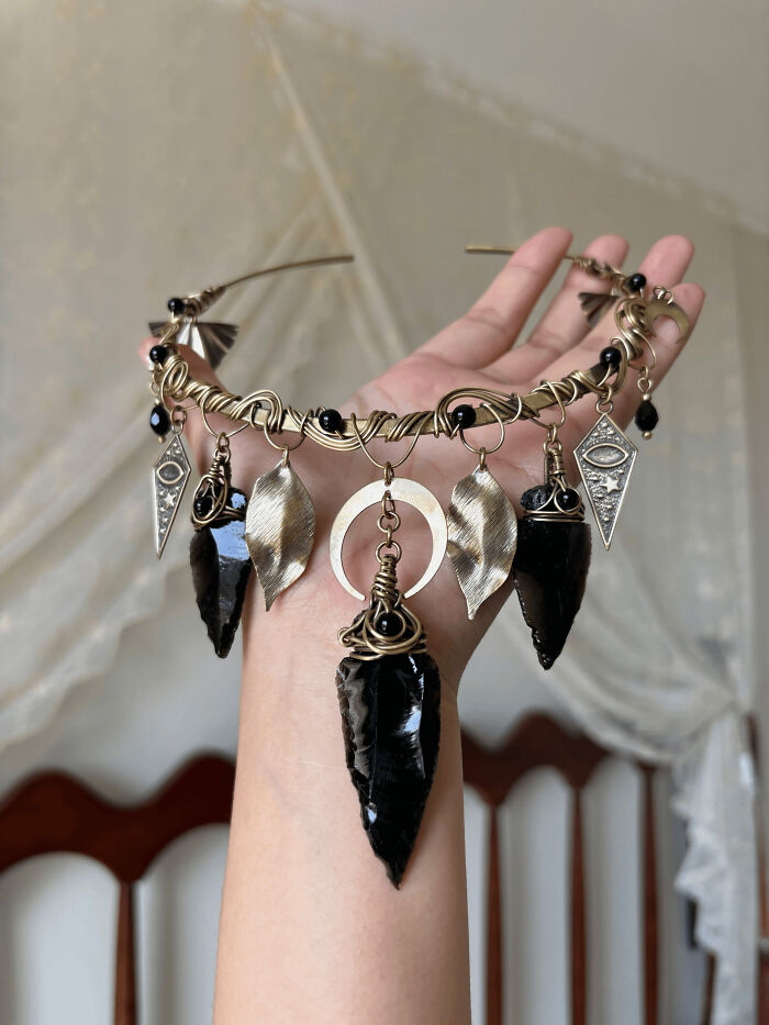 Handmade projects: a unique tribal-inspired necklace with large black obsidian arrowheads and metal accents.