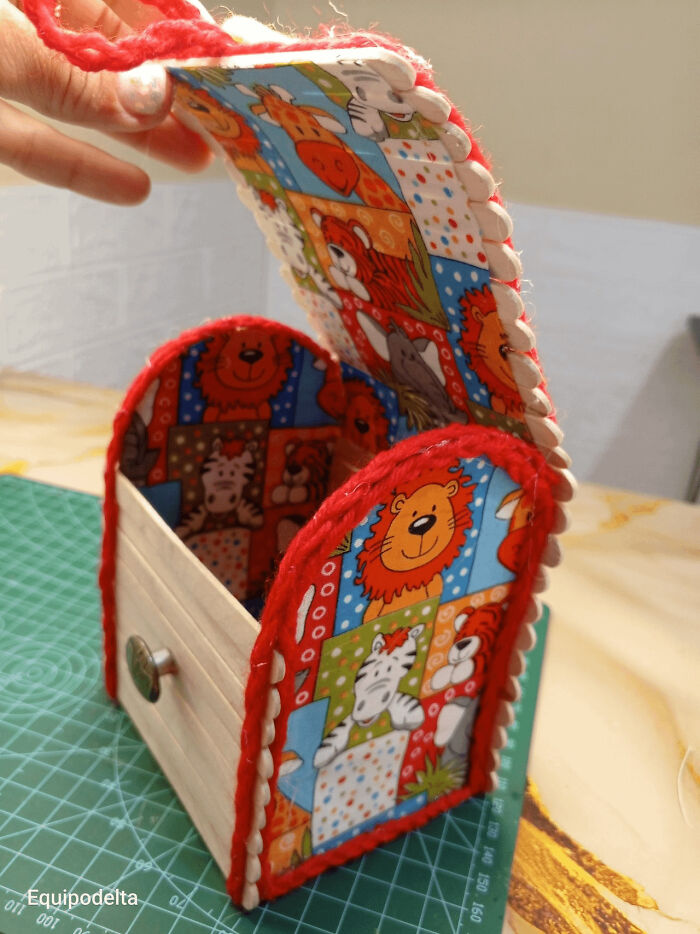 A handmade projects craft box adorned with animal cartoon prints, featuring lion and zebra characters.