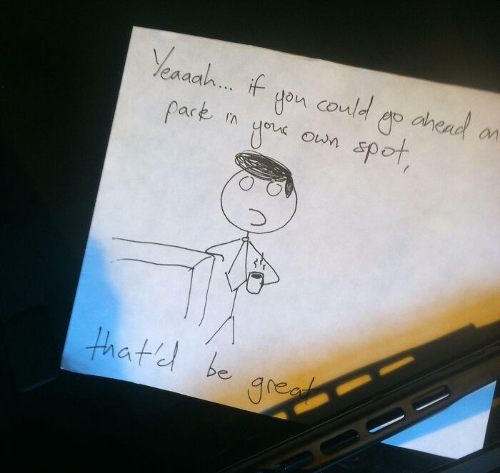 A note with a stick figure illustration, telling the jerk neighbor to park in their own spot.