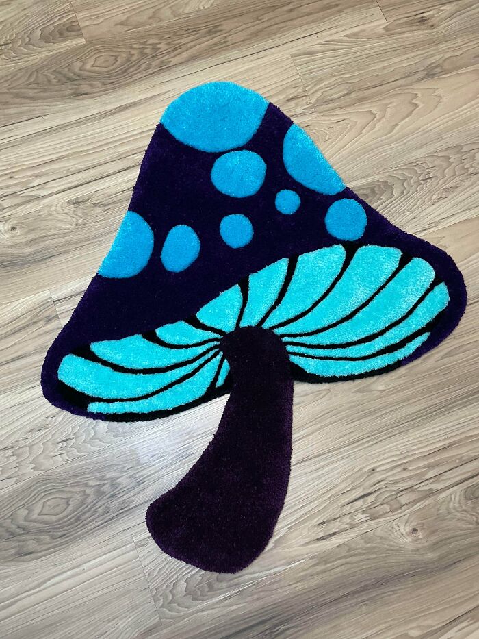 Vibrant mushroom-shaped rug in blue and purple, a funky handmade project.
