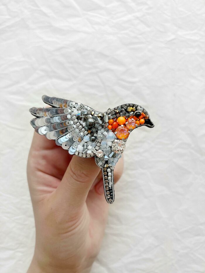 Handcrafted bird brooch made with beads and sequins, a dazzling handmade project.