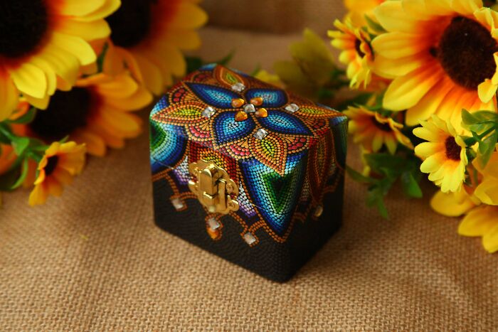 Beautifully painted box with intricate mandala design and sunflowers, an exquisite handmade project.