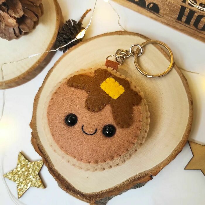 Charming handmade projects: a cute pancake-shaped felt keychain with a happy face, butter, and syrup, perfect for gifts.