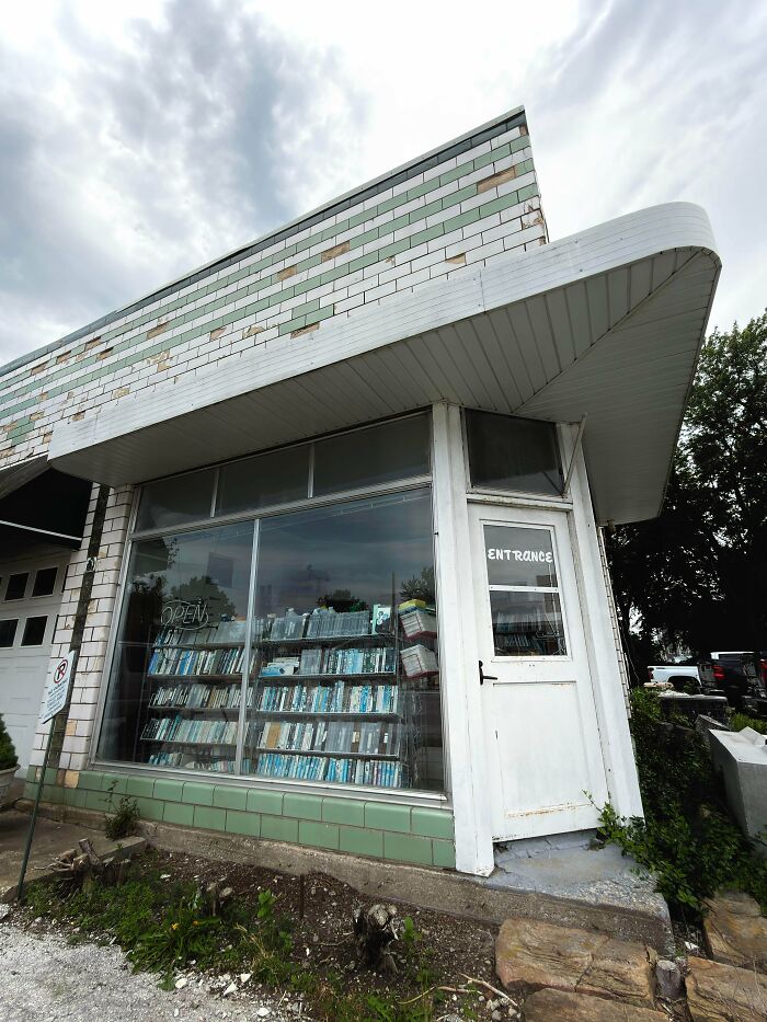 An old, abandoned place, possibly a store, with records visible through its large windows, found while exploring.