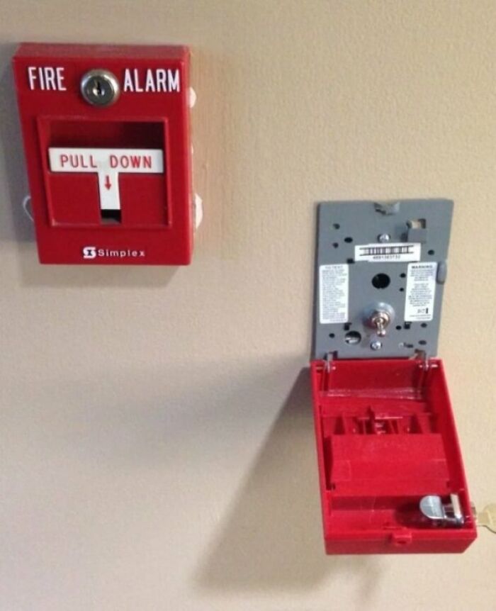 Photo of a fire alarm and its surprising internal mechanism after being cut in half.