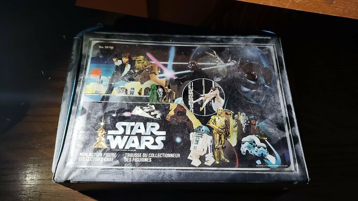 A vintage Star Wars mini action figure collector's case on a dark surface, a very unexpected find while exploring abandoned places.