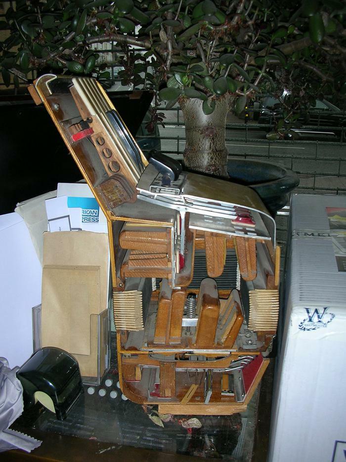 A surprisingly cut in half accordion revealing its intricate internal mechanisms, an interesting photo of an object cut in half.