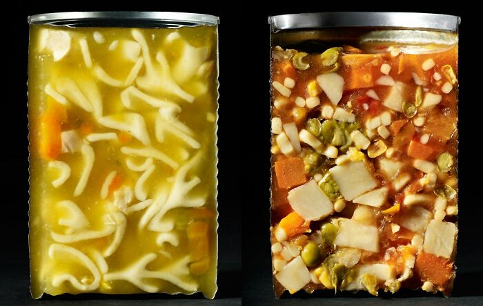 Two cans of soup cut in half, showcasing different noodle and vegetable varieties, part of interesting objects cut in half.