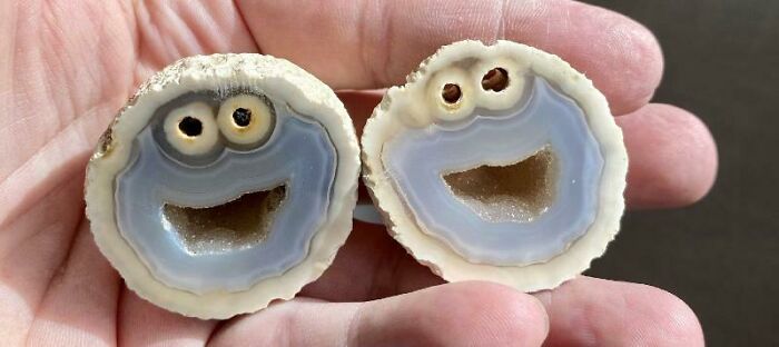Surprising photo of two geodes cut in half, resembling smiling faces with eyes.