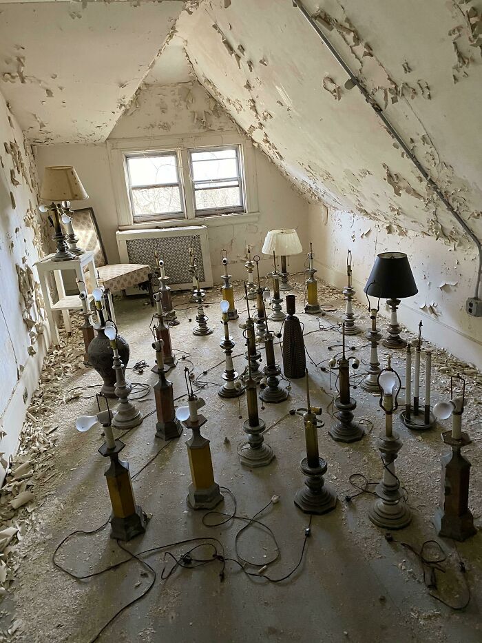 Exploring abandoned places reveals an unexpected attic filled with numerous old lamps and peeling paint.