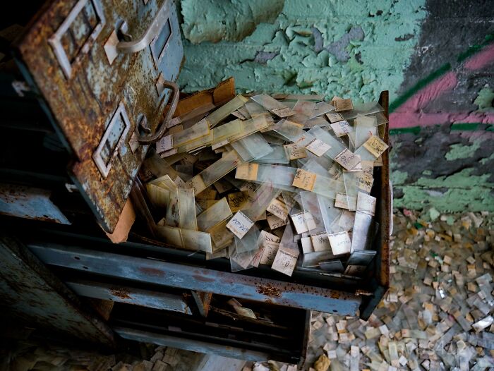 Exploring abandoned places, a drawer overflows with old slides, something very unexpected.