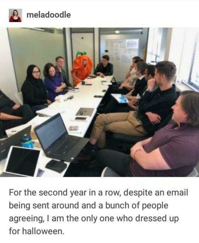 A photo of a person in a pumpkin costume at a meeting, being the only one dressed for Halloween. Best Things Shared On Tumblr.