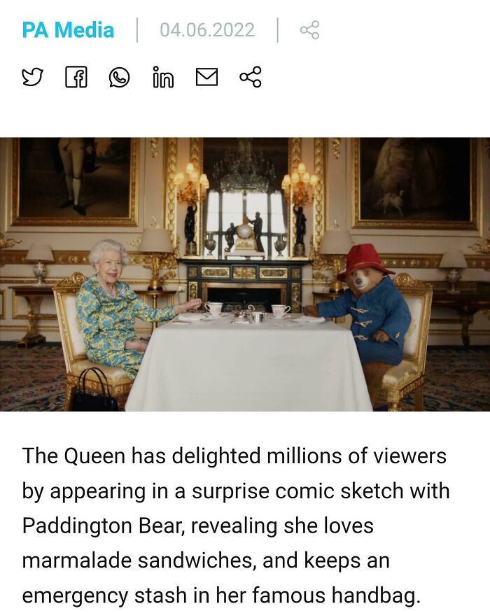 Screenshot of Queen Elizabeth II and Paddington Bear having tea, representing wholesome images.
