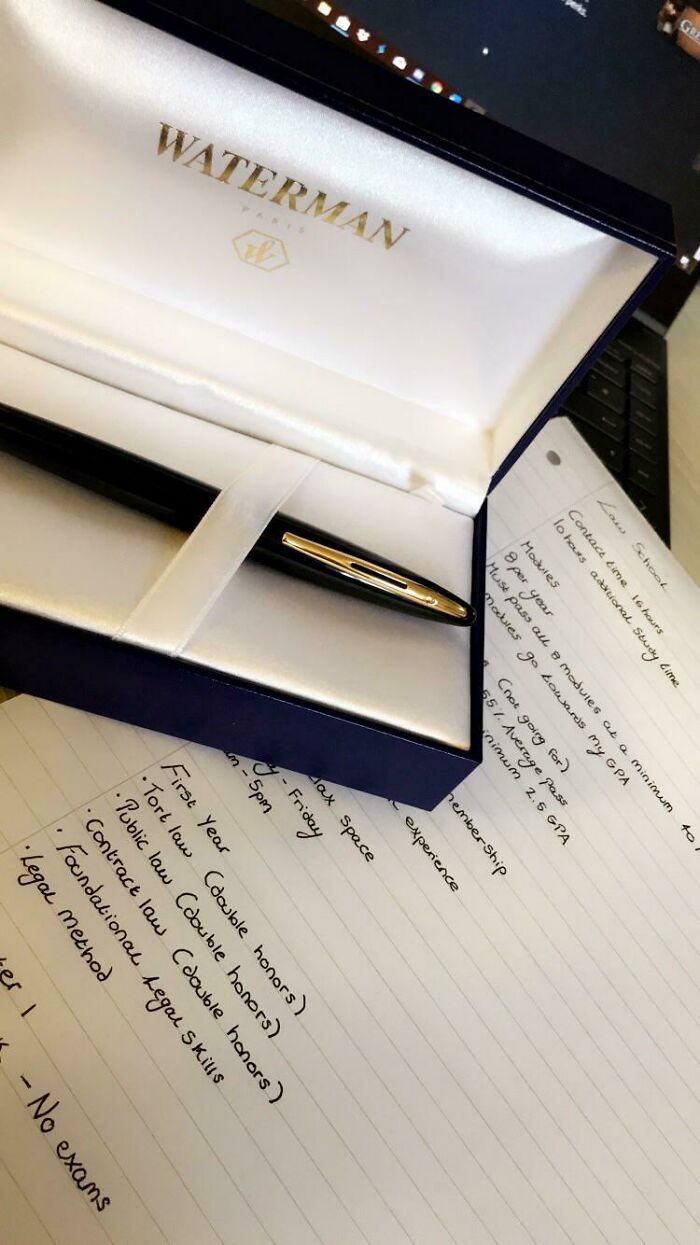 A close-up of a premium Waterman pen in its case next to handwritten wholesome images of law school notes.