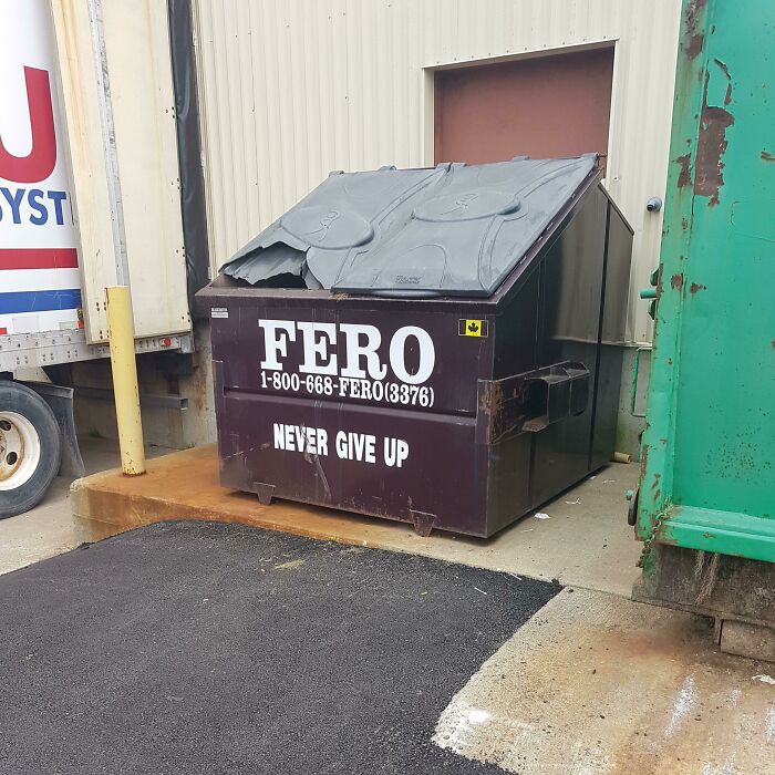 A wholesome image of a dumpster with the motivational phrase NEVER GIVE UP, reminding us to keep trying.