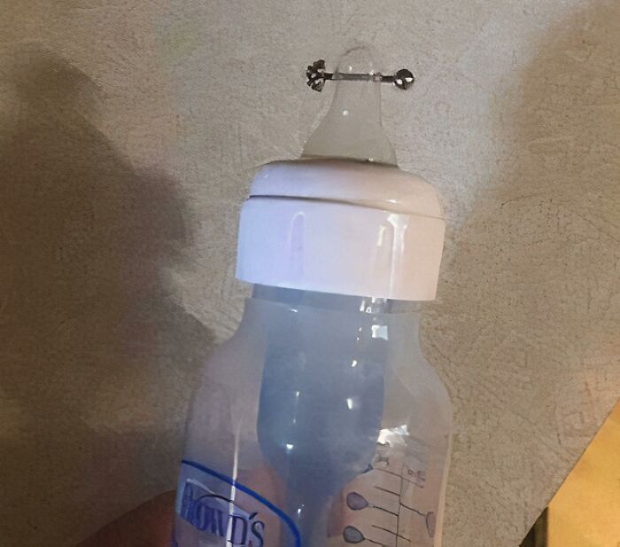 A baby bottle with a metal piercing on the n****e, one of the baffling images.