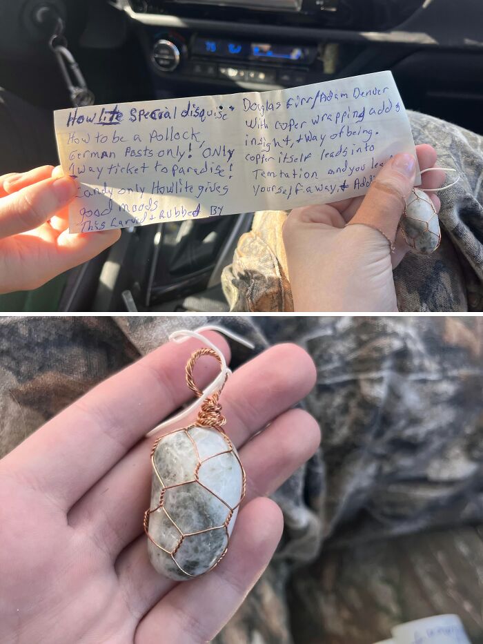 A hand holds a baffling image of a handwritten note and a wire-wrapped stone, creating questions that the internet might answer.