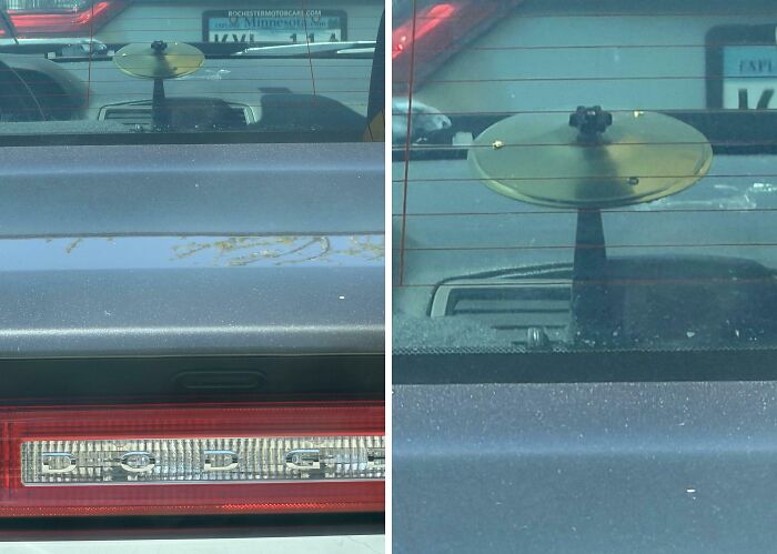 A gold-colored device with a round top attached to a car's rear window, featured in baffling images.