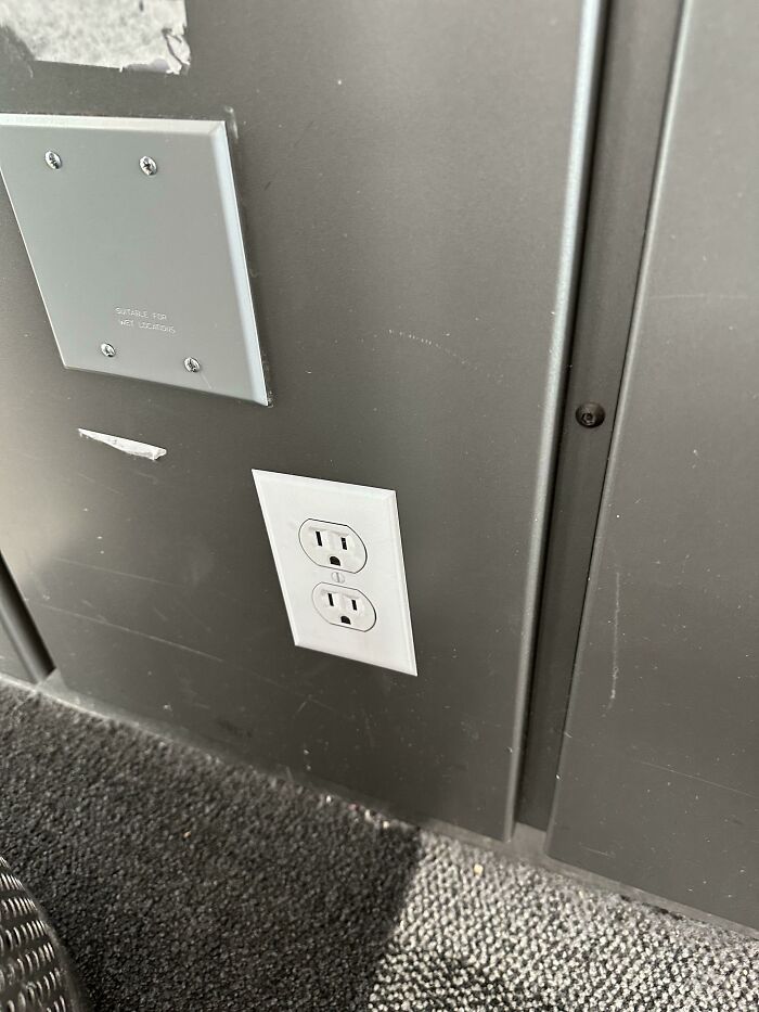 An electrical outlet installed sideways on a wall, showing a detail that went exactly as planned during trips.