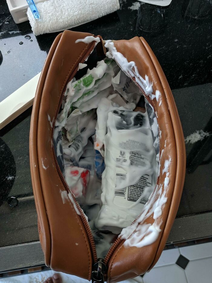 A travel bag with shaving cream exploded inside, making for a messy start to people's trips.