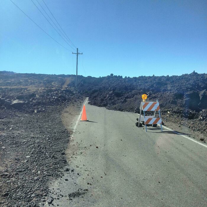 Road closure due to rockfall, blocking a trip and forcing a detour.
