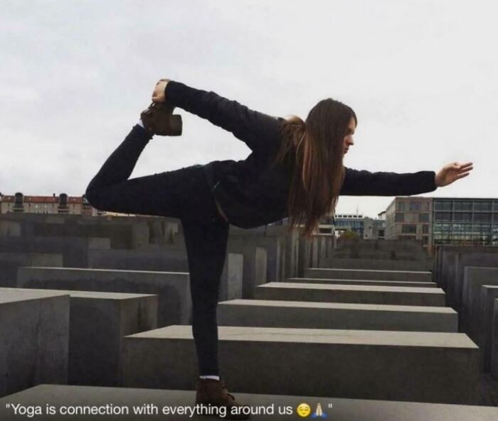 An entitled woman in yoga pose at a H*******t memorial, acting like an extra in her world.