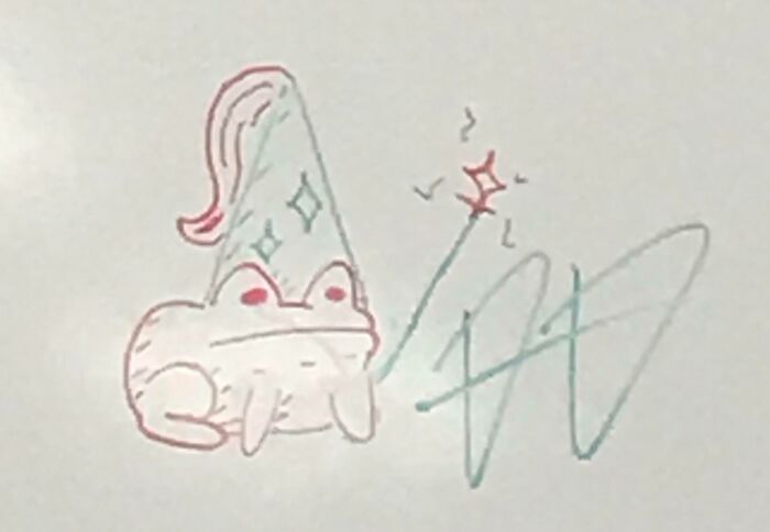 Wholesome images showcasing a simple drawing of a frog wearing a wizard hat, casting a spell.