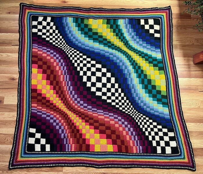 Colorful crochet blanket with wavy checkerboard pattern