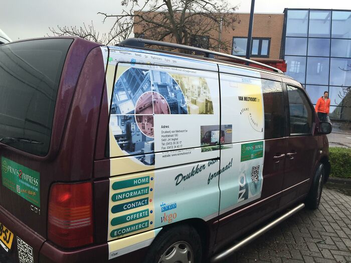 A van wrapped in an advertisement showing a browser window as a design fail.