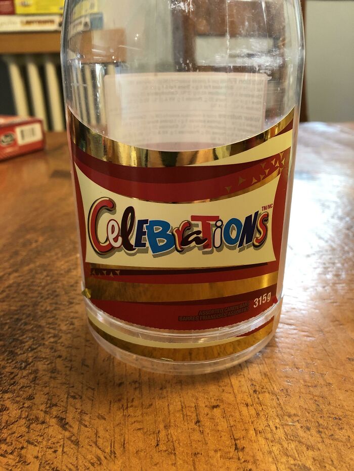 A clear plastic bottle with a label reading 'Celebrations' but with a noticeable spelling error, exemplifying a design fail.