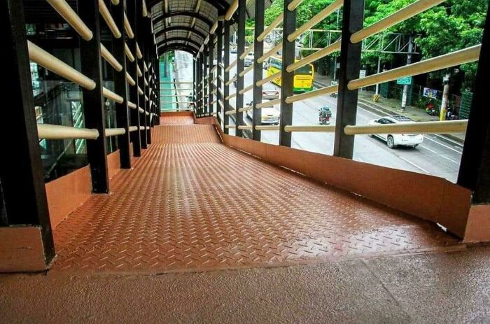 An accessibility ramp that is extremely steep, showcasing a clear design fail in public infrastructure.