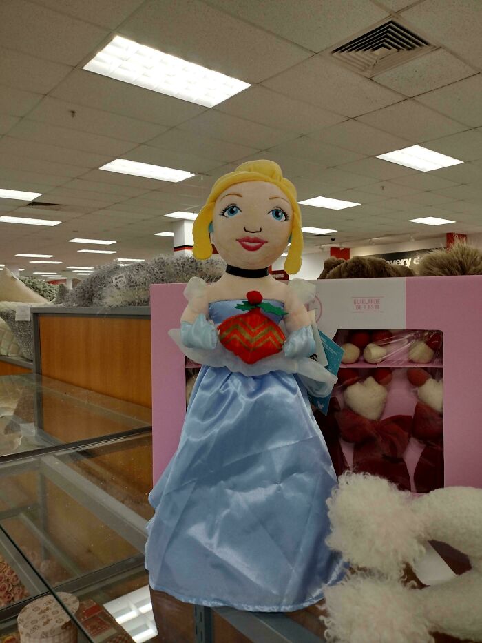 A plush doll of Cinderella with a disproportionate head and small features, displaying a clear Design Fails.