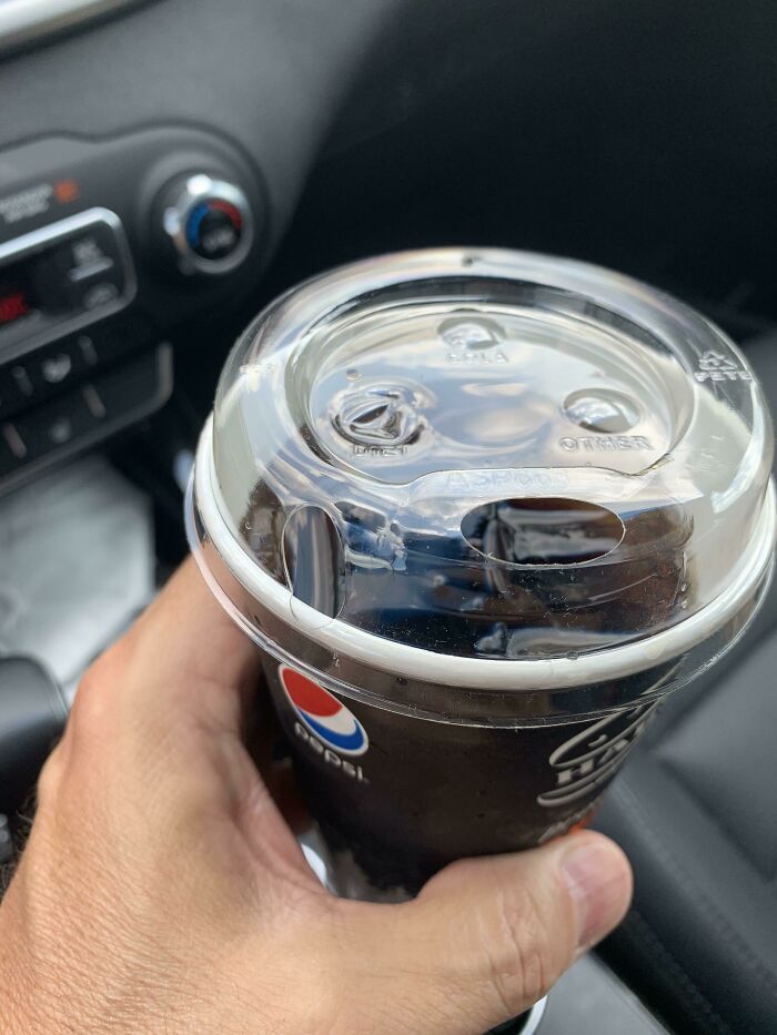 A Pepsi cup with a lid that has a straw hole and two other sealed holes labeled DIET and OTHER, showing design fails.