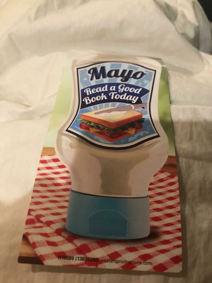 A bookmark shaped like a mayonnaise bottle with the words Mayo Read a Good Book Today, an example of design fails.