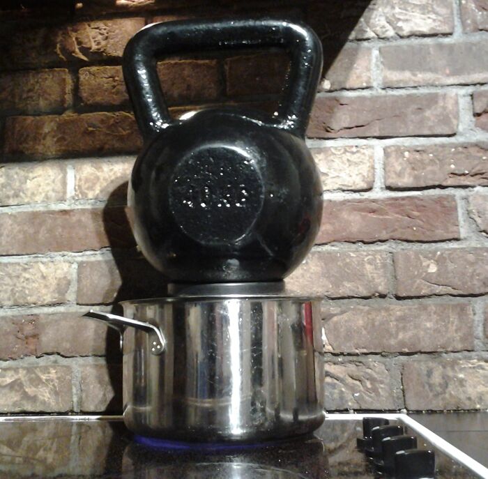Hilariously bad DIY example: A heavy kettlebell balancing on a pot on a stovetop.