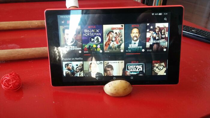 A DIY tablet stand made from a potato, showcasing a bad example of DIY ingenuity.