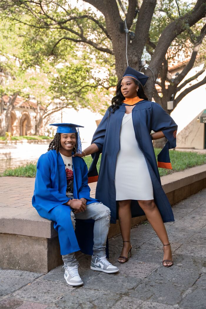 Two graduates in caps and gowns smiling outdoors, representing their incredible accomplishments in education.